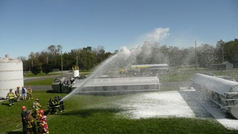Firefighters use foam to contain chemical fires